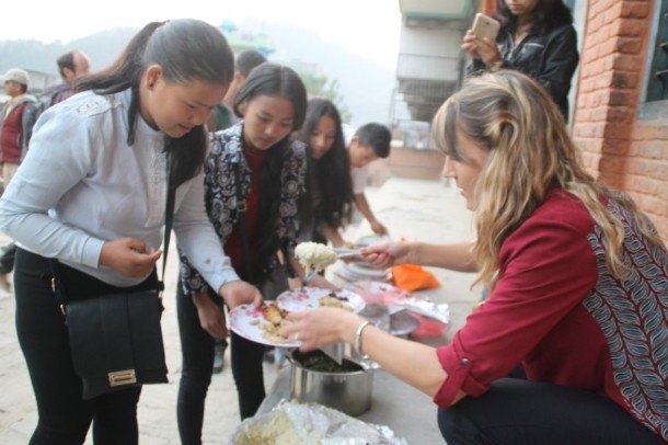 elf-stela-wasson-serving-special-thanksgiving-food-to-pokhara-access-students