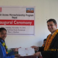 RELO Russell Barczyk handing over Access Commencement certificate to Dhading Access student